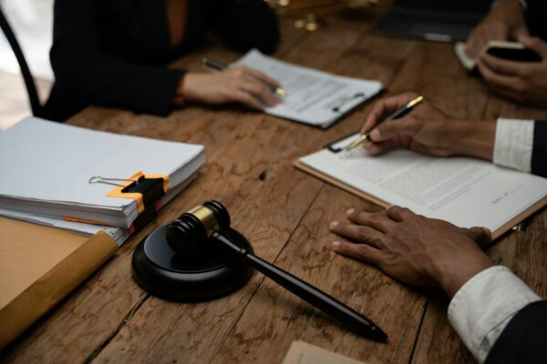 close-up-lawyer-businessman-working-or-reading-lawbook-in-office-workplace-for-consultant-lawyer-con.jpg